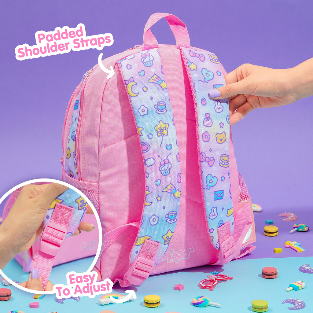 Holding a cute girls’ backpack for school. Featuring pink kawaii designs.