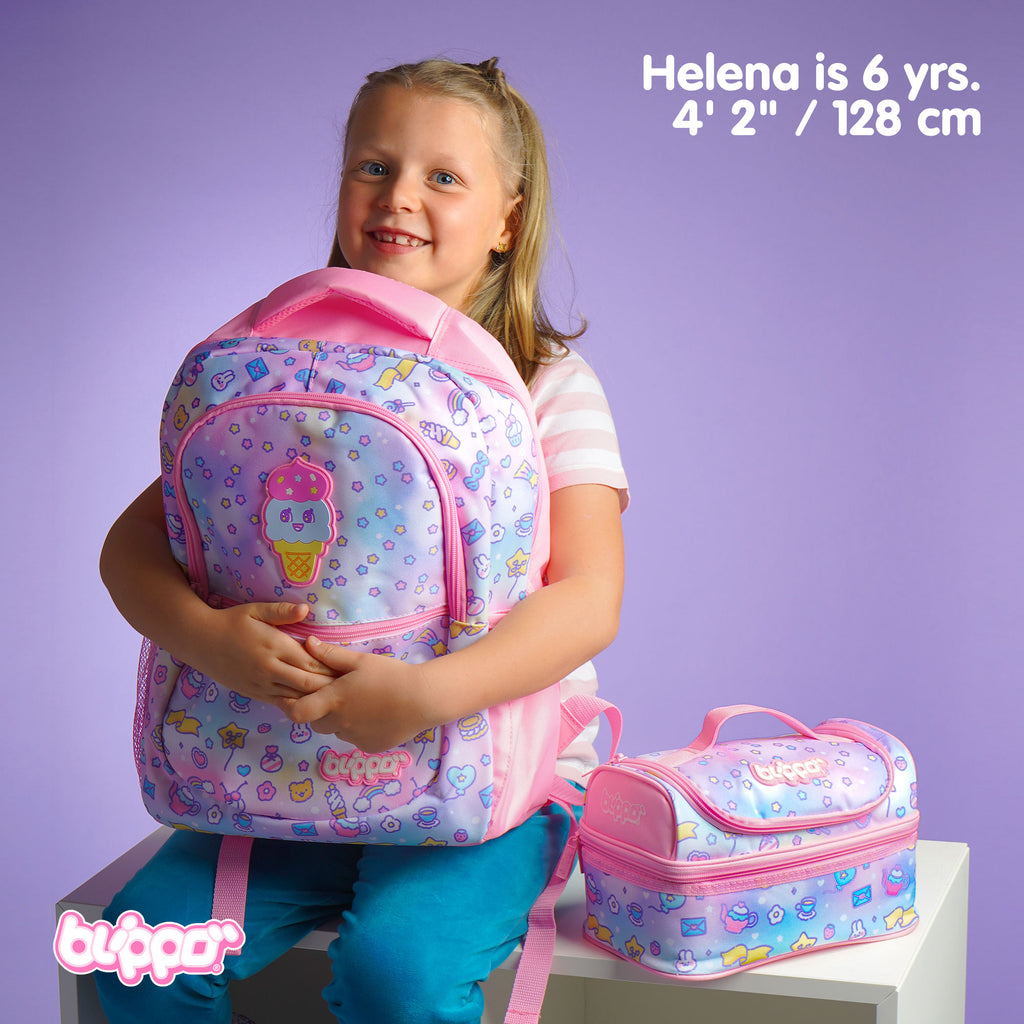 Girl holding a cute girls’ backpack for school. Featuring pink kawaii designs.