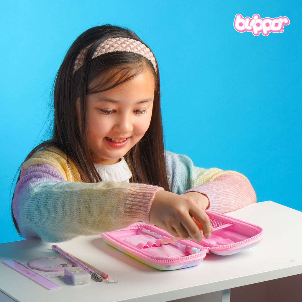 Girl opening a pink kawaii pencil case for girls. Cute pencil case for kids. 