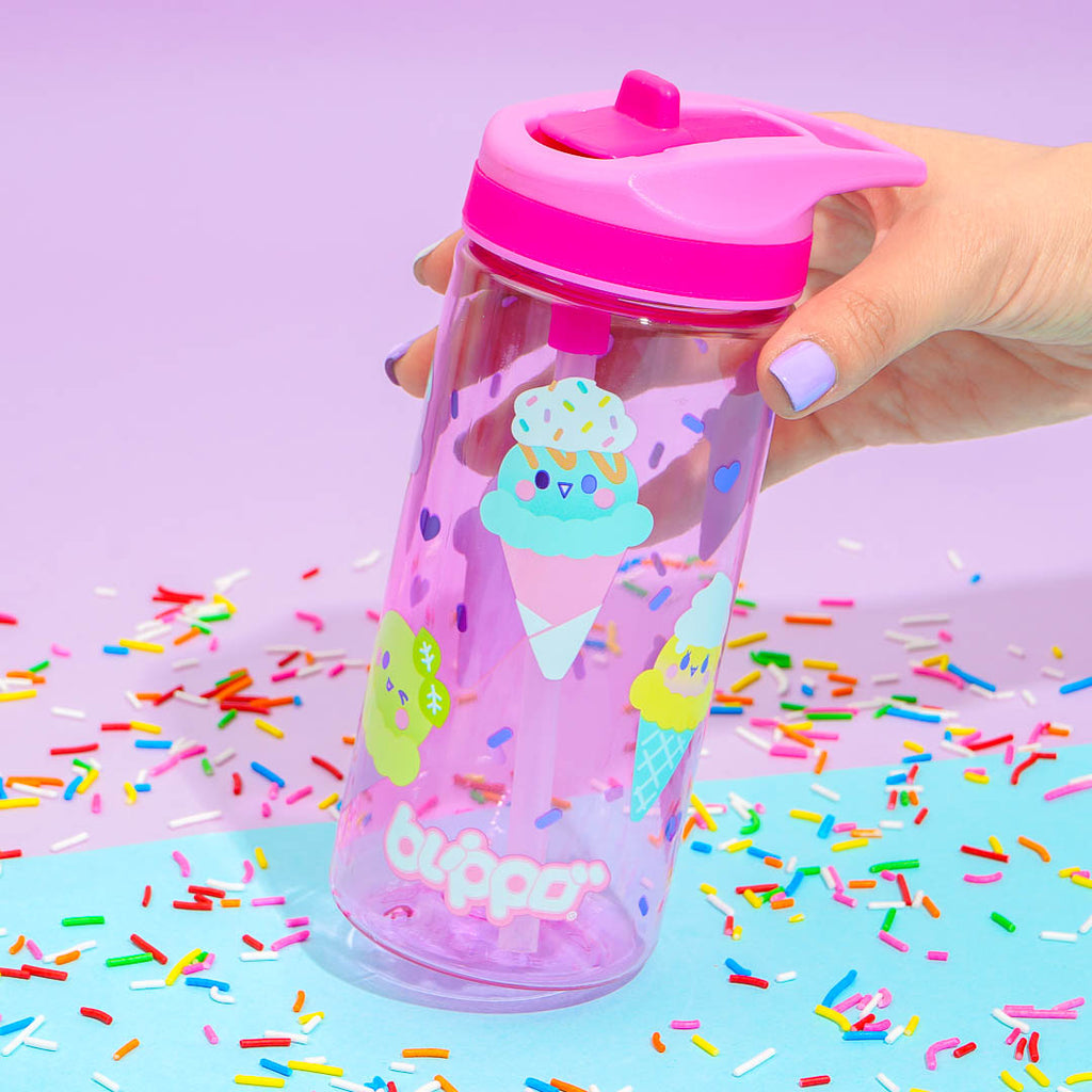 Holding a cute pink water for toddler girls and featuring kawaii designs.